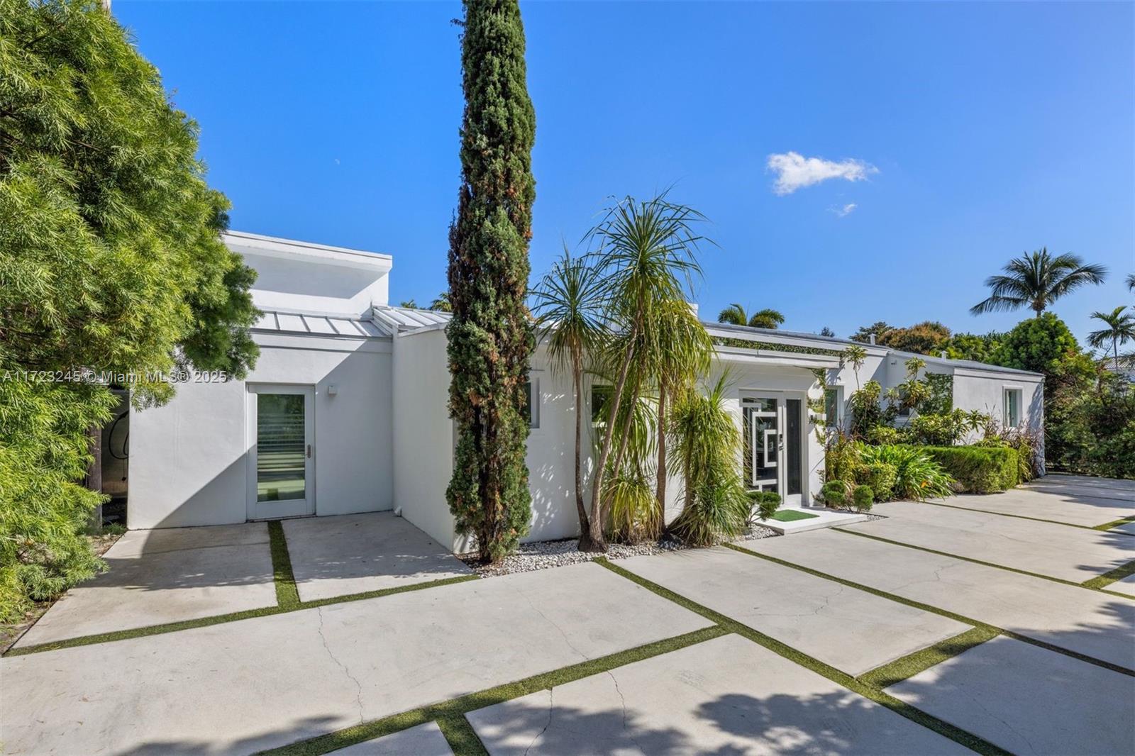 This stunning 6-bedroom, 5.5-bath home is a true gem! Situated on a sprawling corner lot in one of the most sought-after neighborhoods, it effortlessly blends style, comfort, and functionality. The home is filled with natural light, highlighting the modern design and spacious living areas. Step outside to your own private backyard paradise, featuring a sparkling pool, expansive patio, and lush greenery—perfect for both relaxing and entertaining. Just minutes from the beach, as well as top-notch dining and shopping, this home is a rare find. Whether you're searching for your forever home or an income-generating property, this one has it all! Currently operating as a successful Airbnb, it's a fantastic opportunity.