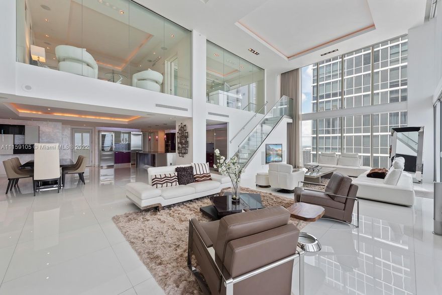 Exquisite tri-level, custom built, lower penthouse that boasts the finest details through-out, with breathtaking picturesque bay, city and ocean views! This 4 bedroom 5.5 baths is 4450sf (PER CONDO ASSOCIATION)) 1749sf exterior, with 20FT soaring ceilings with expansive walls of glass! Architect/design by EcoTek (Jan Stanbury) Opustone white porcelain floors 3x3 tiles, La Finestra metal & glass doors, Moduhome Italian closets, summer kitchen with private pool and patio on the third floor. This fabulous home in the sky, is located in the Ten Museum Park, a boutique building with a world renowned spa, with 5-star service: 24-hr concierge, valet, full service gym, wave pool, yoga, cycling, steam room/spa with massage available.