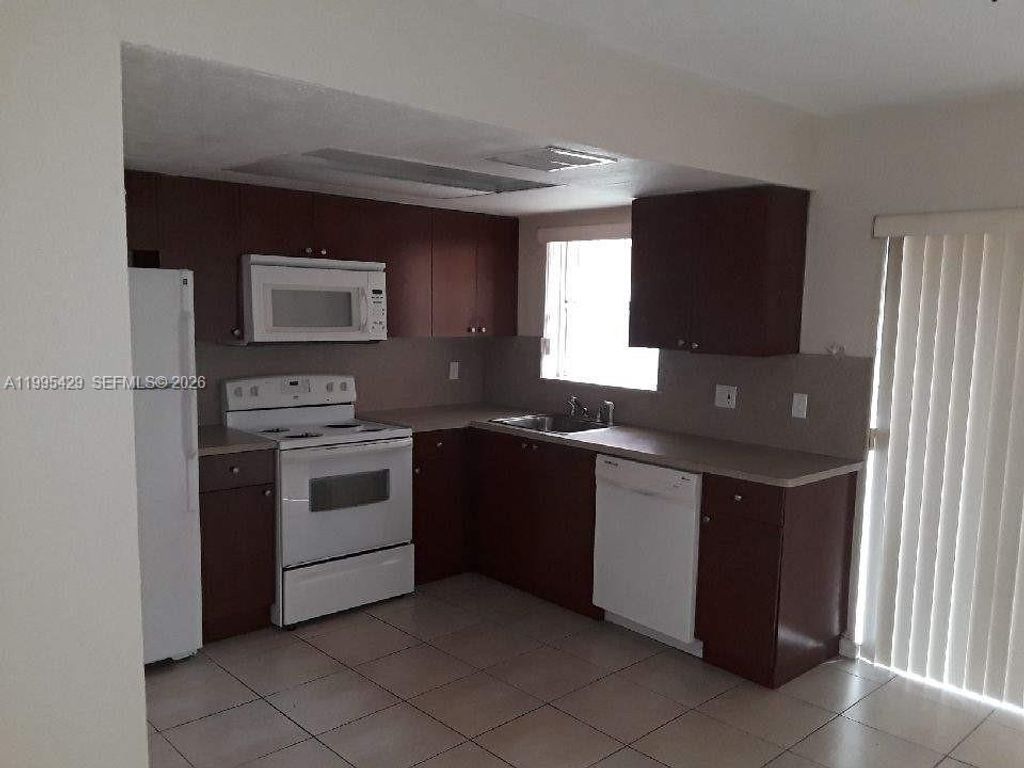 Photo of 2604 NW 52nd Ave #C15, Lauderhill, FL 33313 (MLS # A11995429)