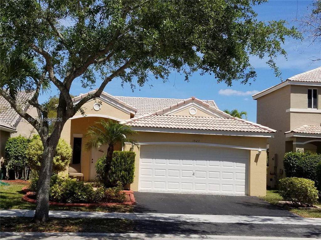 Photo of 1527 Palermo Dr, Weston, FL 33327 (MLS # A12012331)
