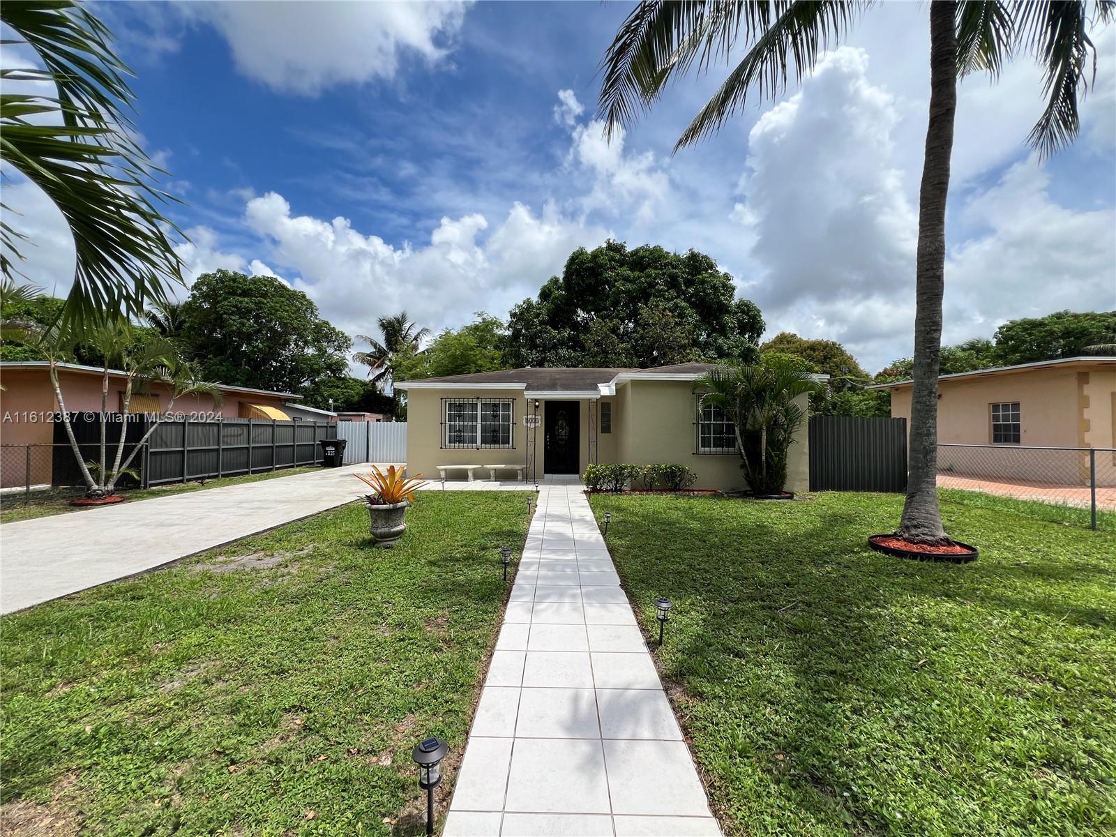 Discover your new home in this charming single-family residence located in North Miami. Featuring 2 bedrooms and 1 bath, this cozy abode boasts 805 sq ft of living space under A/C. The property sits on an expansive 8000 sq ft lot, fully fenced for privacy with a new aluminum fence in the back. Enjoy the lush outdoors with mature mango and avocado trees, and entertain guests under the pergola, perfect for BBQs and gatherings. The bathroom has been tastefully remodeled, and painted inside and out, adding modern touches to this delightful home.