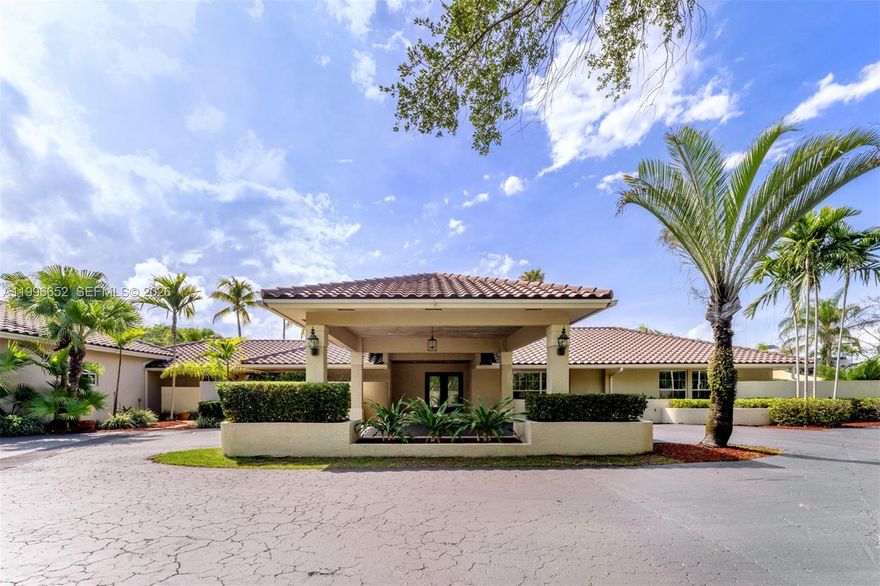Rare opportunity in an ideal Palmetto Bay location! Situated on a sprawling 37,897 SF canal-front corner lot, this 6-bedroom, 4-bath residence offers endless potential to create your dream estate. Tucked away on a quiet street, the property features expansive grounds with ample space to park boats, RVs, and additional vehicles. The home offers two separate entertainment areas, a charming working fireplace, and a covered summer kitchen area overlooking the backyard and canal. Whether you choose to renovate and reimagine the existing residence or start fresh with a brand-new custom home, the lot, location, and setting make this a truly special offering. Surrounded by lush greenery and estate-style homes, this property is ideal for buyers seeking privacy, space, and exceptional potential in one of South Florida’s most desirable neighborhoods.