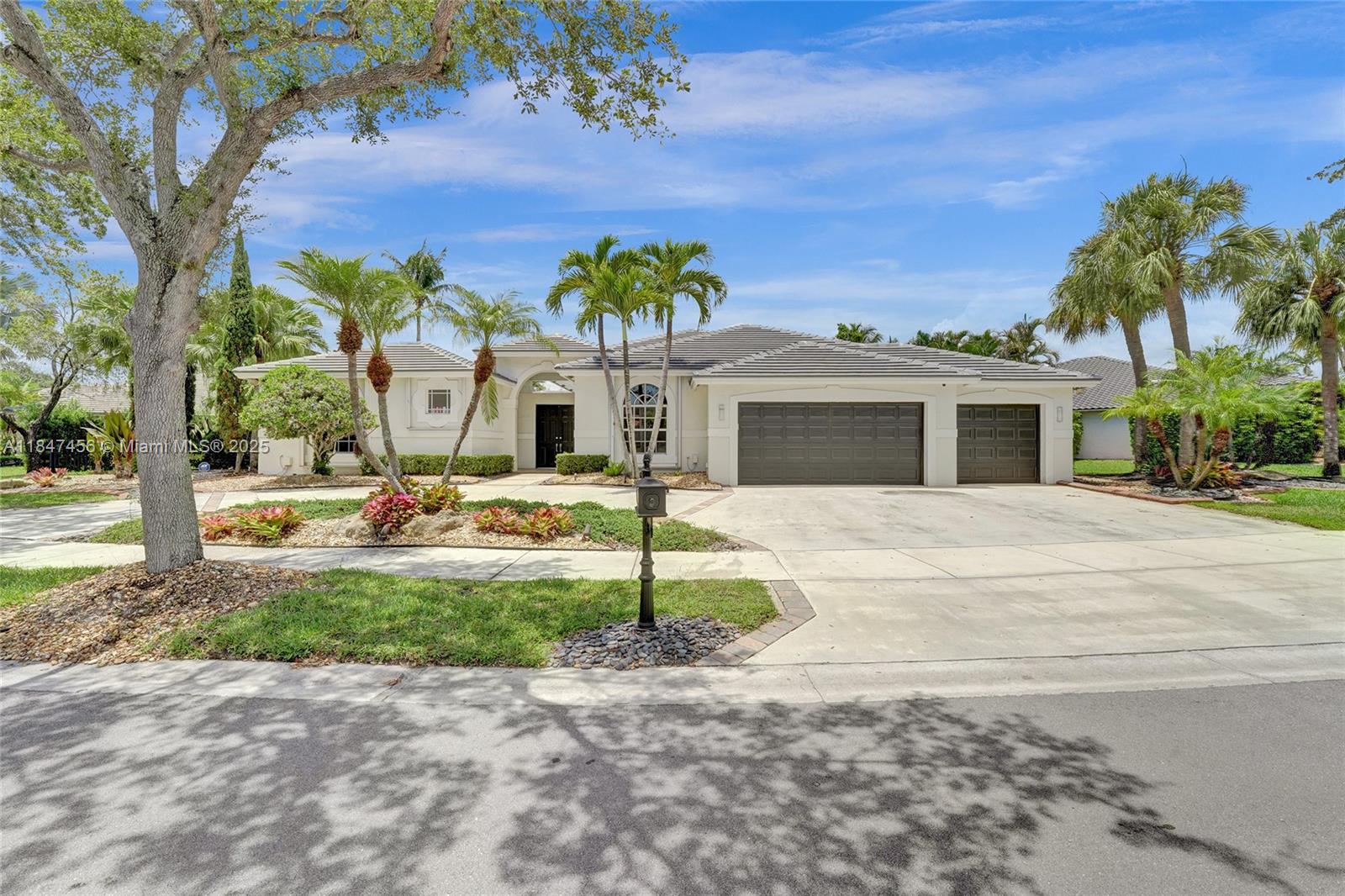 Welcome to 208 Landings Blvd—a beautifully maintained 5-bed, 3.5-bath home located in the sought-after gated community of The Landings in Weston. This spacious residence offers an open floor plan with vaulted ceilings, abundant natural light, and a beautiful kitchen with marble countertops and stainless steel appliances. The primary suite features two walk-in closets and a spa-like bath with dual vanities and a soaking tub. Enjoy Florida living with a private courtyard and a detached bedroom/bathroom perfect for entertaining. Zoned for A+ Weston schools, close to parks, shopping, and major highways. Enjoy peace of mind with a 1-year-old roof. Low HOA, 24-hour guard-gated security, and community pride of ownership. Move-in ready!