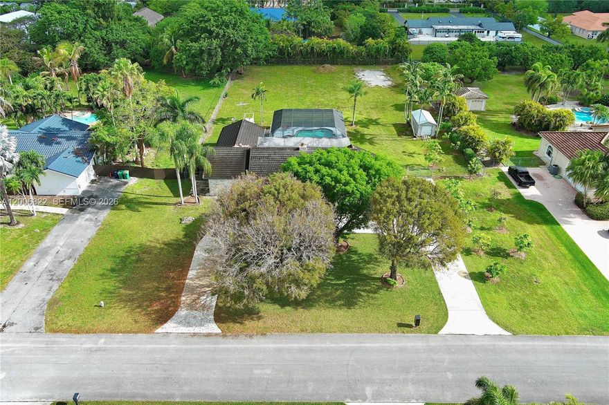Redland Gem! Solid 4-bedroom, 2-bathroom home on a spectacular 1.05-acre lot (No HOA). This property offers ultimate security with a 40KW Triton whole-house generator, hurricane shutters, and a durable concrete roof. Enjoy a spacious screened-in pool and unlimited space for boats, RVs, or trucks. The home has been impeccably maintained in its original 1988 condition, providing the perfect canvas to modernize and gain immediate equity. Prime location offering total privacy with quick access to major roads. Schedule your showing today!
