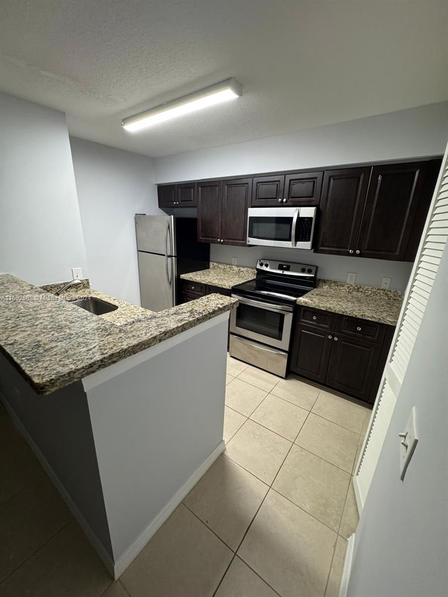 Charming 1 bed, 1 bath condo in gated West Palm Beach community! Conveniently located near shopping, schools, and stores. This unit includes an in-unit washer and dryer for added ease. Enjoy fantastic amenities: a refreshing swimming pool, fully equipped fitness center, and relaxing hot tub. Perfect for comfortable and secure living with everything you need close by! **Furniture will be removed before Buyer moves in**