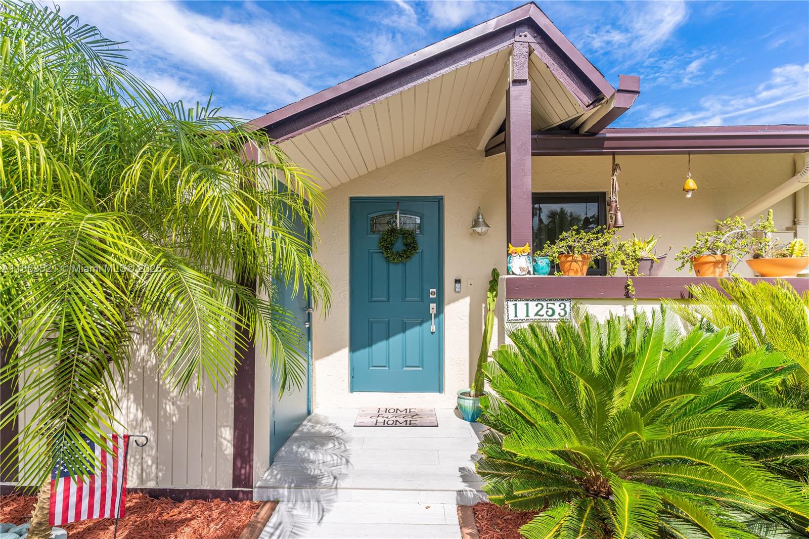 Step into this beautifully remodeled 2 bed-2 bath townhouse at Killian Pines, designed with modern farmhouse charm. The open interior boasts wood-look tile floors, recessed lighting, a stunning kitchen with custom wood cabinetry, Calacatta quartz counters, stainless steel appliances, and tankless water heater (2022). Impact windows & doors, remodeled baths, and a custom walk-in closet elevate the home’s style. A custom barn door opens to an office/laundry space, while the private patio, lined with clusia hedges and bistro lights, is perfect for relaxing or entertaining. Enjoy convenient parking right at your doorstep with plenty of guest spaces. No HOA approval—move right in! Walking distance to MDC Kendall, dining, and gyms, plus quick access to highways and shopping.