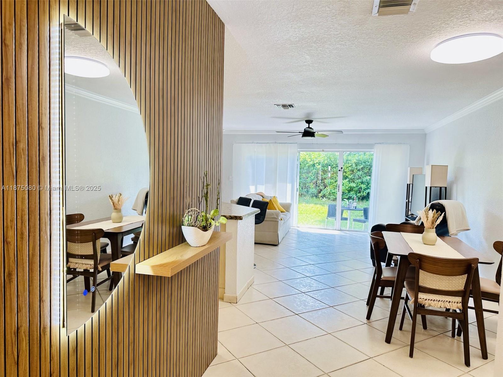 Beautiful 3 bedroom, 2 1/2 bath Townhome featuring kichen granite counters, tile backsplash with under-cabinet lighting, and stainless-steel appliances—including a 2022 Whirlpool microwave, 2022 Bosch dishwasher, 2019 Samsung French-door refrigerator, and 2019 GE range. The first floor showcases tile flooring, while the stairs and second floor are finished in elegant wood laminate. Accordion shutters secure every window, complemented by a full security system. Enjoy peace and privacy in your serene backyard with lovely green views. The garage includes laundry, an extra refrigerator, an automatic door opener, plus a 2019 hot water heater and 2016 HVAC. Don’t wait—schedule your private tour today and see how effortlessly this home blends comfort, style, and tranquility.
