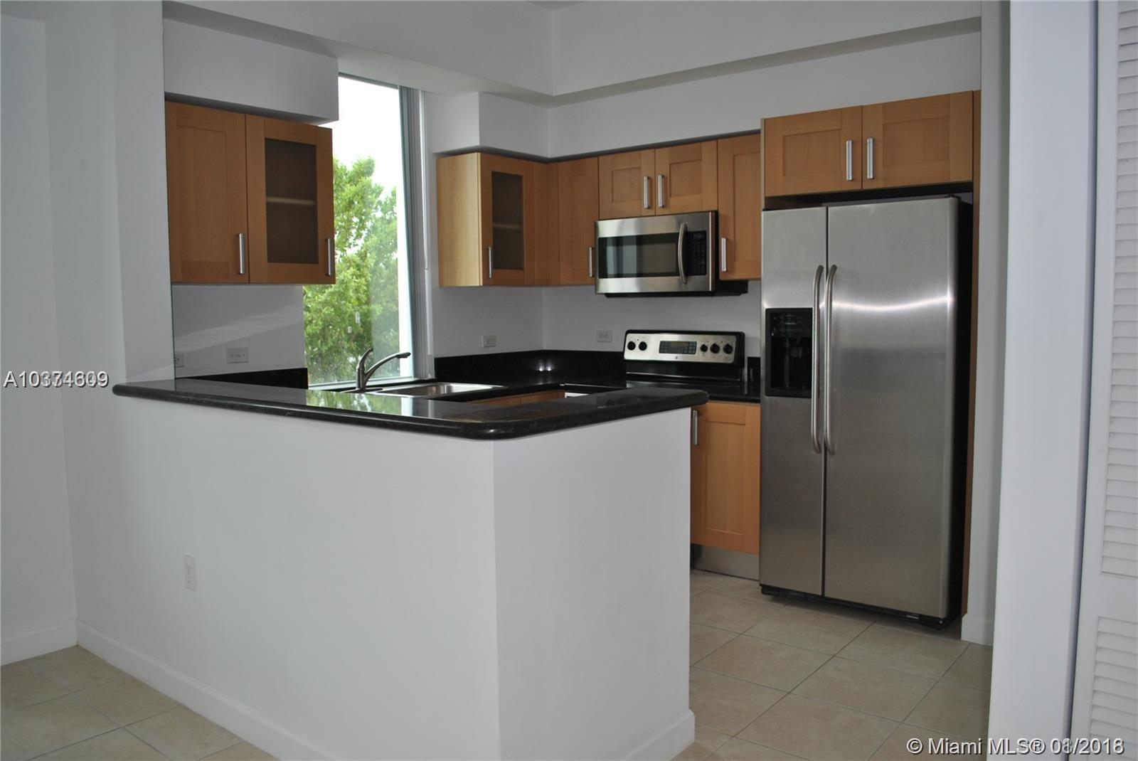 LOCATION Walk to downtown Hollywood, minutes from Airport and the Beaches. 3 levels of luxury living with 3 Bedroom, 3 1/2 bath, den, & 2 car garage. NICE kitchen with stainless steel appliances including side by side refrigerator with water and ice maker, self cleaning oven, dishwasher, and microwave oven, granite counter tops, European style cabinetry, washer-dryer; MASTER bedroom suite with walk-in closet, whirlpool tub, separate shower, twin vanities with marble counter tops, and marble floor.