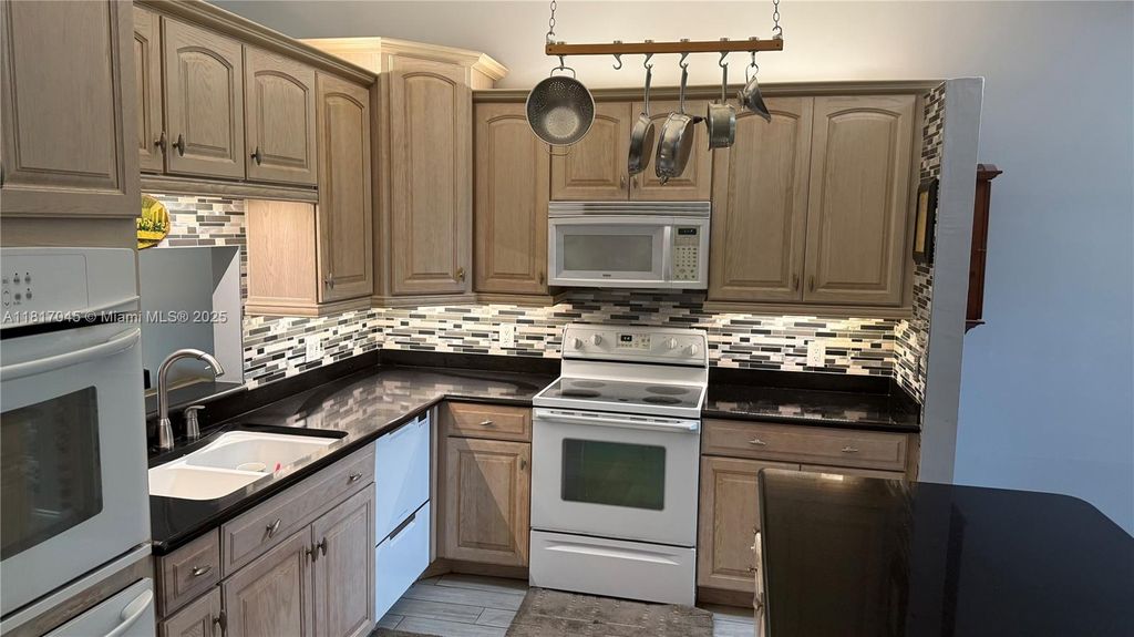 Photo of 1116 NW 50th Dr #1116, Deerfield Beach, FL 33064 (MLS # A11817045)