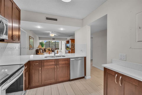 Photo of 1530 Whitehall Dr #302, Davie, FL 33324 (MLS # A12100212)