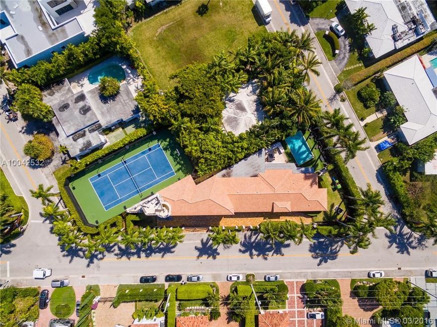 Best of Bay Harbor Islands. This beautifully finished home is situated on a double lot, boasting exquisite grounds, tennis court, full sauna/gym, and stunning infinity edge pool. 6/6.5 home features a spacious living areas, Viking Professional kitchen, onyx and marble floors throughout, and over 500k worth of Crestron sound/security systems. Massive master suite and large bedrooms.