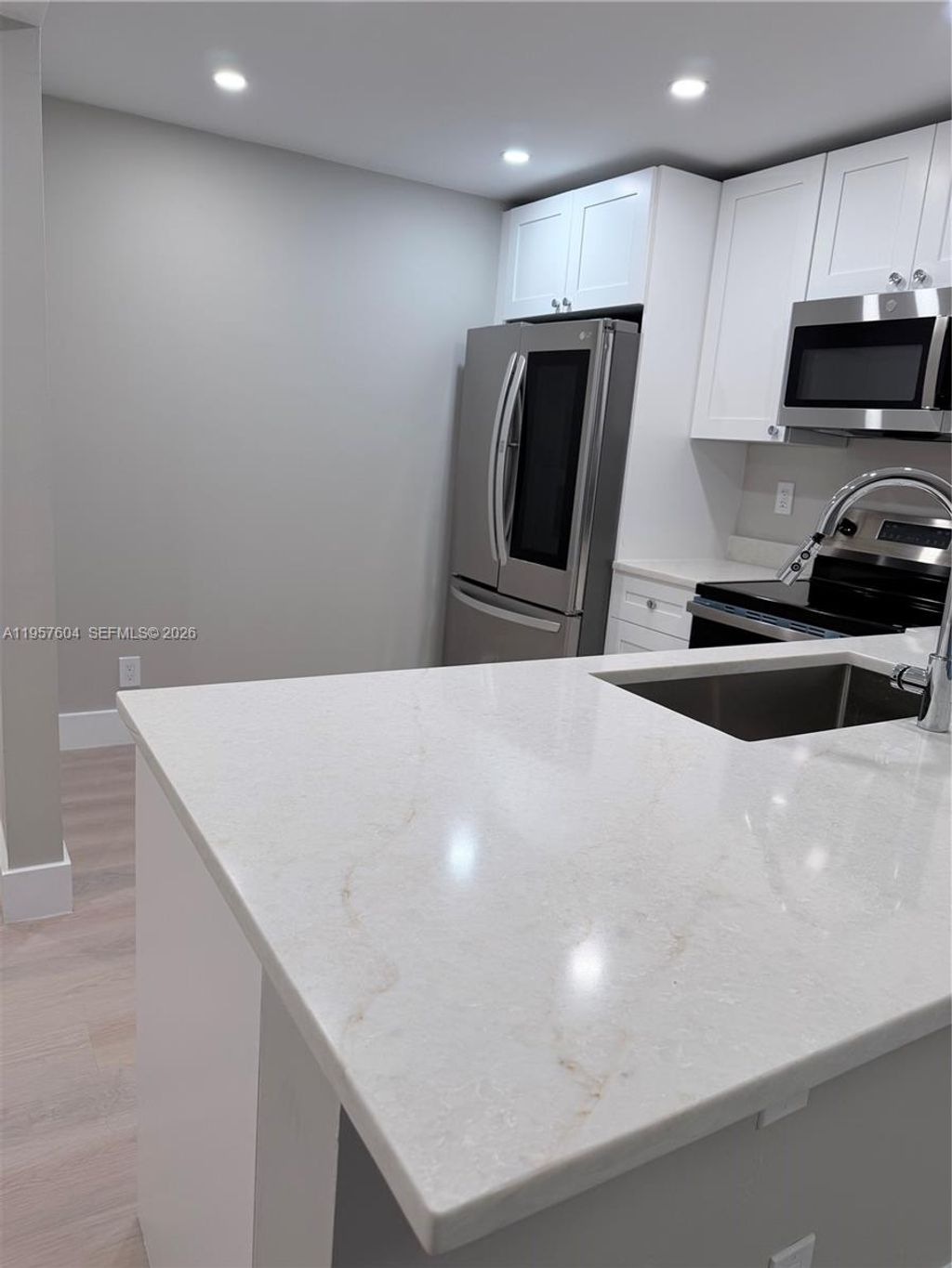 Photo of 2324 S Cypress Bend Dr #117, Pompano Beach, FL 33069 (MLS # A11957604)