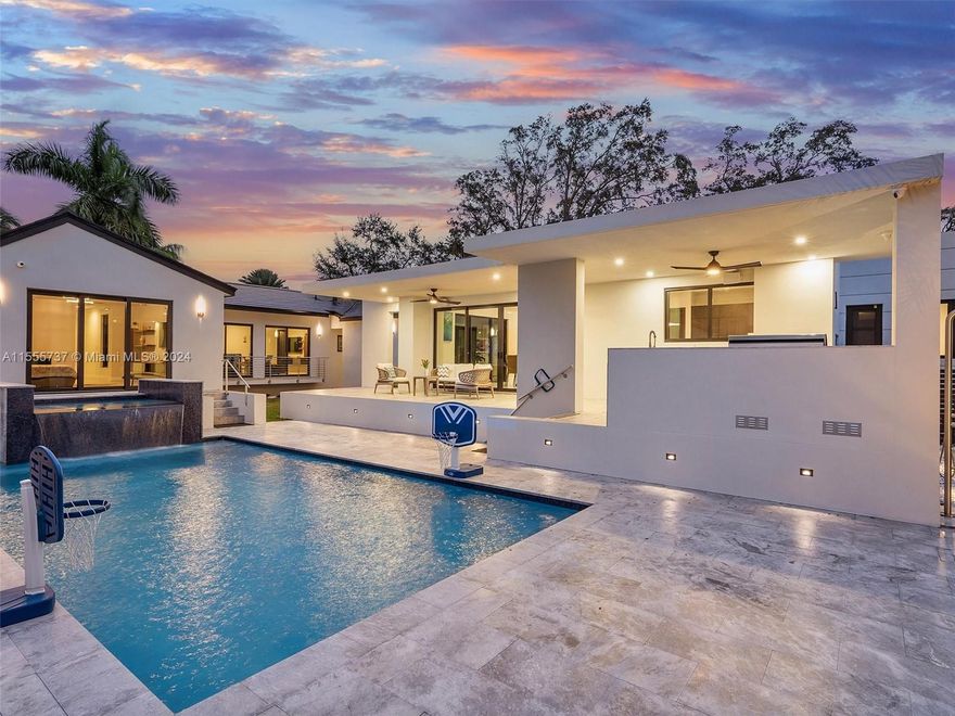 A newly built extraordinary Miami Shores listing east of Biscayne Blvd sits on an expansive 18k sq ft triple lot. The modern marvel showcases a Tesla roof with 72 hours of electrical energy, a surround system, an outdoor kitchen, a heated salt system pool w/marble deck, an outdoor shower, two AC units, and a water filter. It also has a two-car garage, carport, basketball court, and alarm system with cameras. Discover this magnificent home w/ 5 bedrooms adorned w/motorized blinds, an additional den/office &/or gym, and 5 bathrooms with upscale Koehler finishes. The chef's kitchen boasts Sub-zero and Wolf appliances. This epitomizes elegance and functionality for the discerning homeowner in a newly constructed haven.