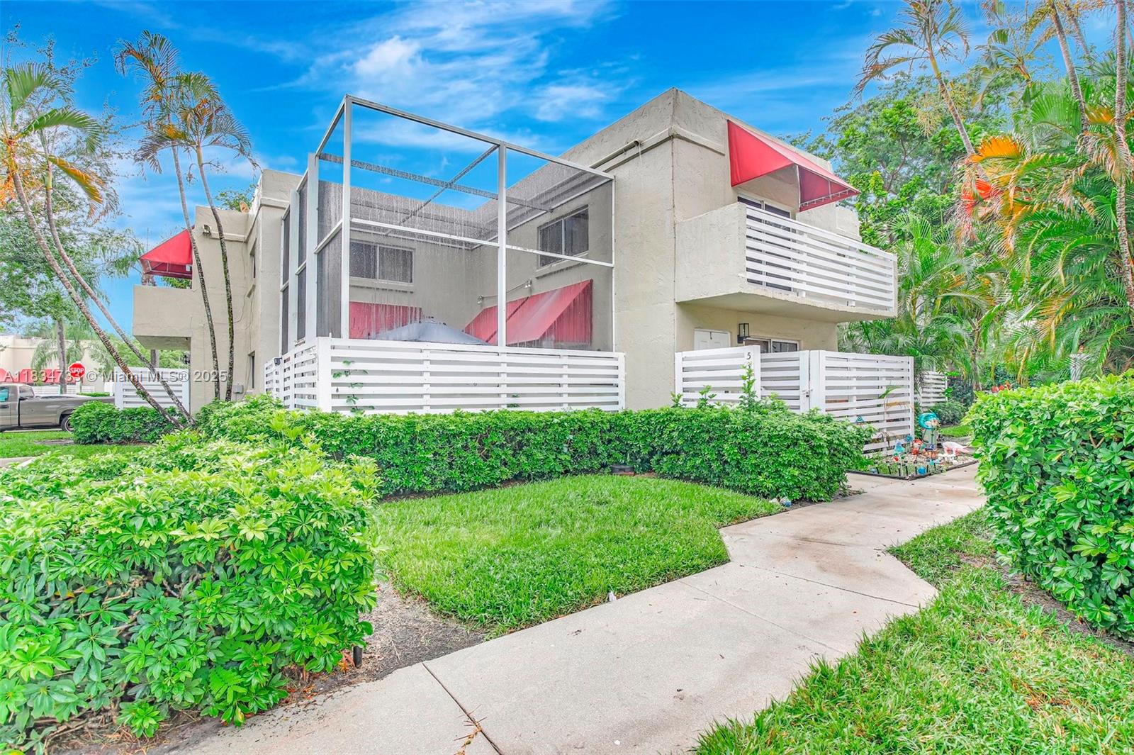 Beautiful 3-bedroom, 2.5-bath townhome in an unbeatable Plantation location. The updated, eat-in kitchen features custom cabinetry, quartz countertops, and stainless steel appliances. Enjoy tile floors throughout and an open-concept layout with one bedroom downstairs and two upstairs, including a spacious primary suite with walk-in closet and private balcony. The large screened-in courtyard with exterior access is perfect for entertaining. This move-in-ready home includes in-unit washer/dryer, two dedicated parking spaces, access to a community pool, and a low HOA. Conveniently located near shopping, dining, parks, and major highways—plus, it's the best-priced unit in Arbor Courts!