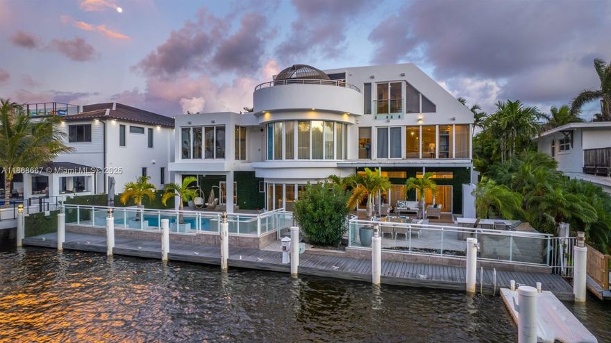 Step into the epitome of contemporary luxury with this stunning 7BR/8.5BA waterfront masterpiece in Fort Lauderdale. Boasting 90’ of frontage, this three-level estate captures breathtaking views from the primary suite, rooftop patio, and lush backyard. Walls of glass, open floor plan, impact windows, top-of-the-line appliances, and advanced security define modern elegance. Entertain with a rooftop terrace, summer kitchen, and private dock. Fully furnished and available for immediate occupancy.
