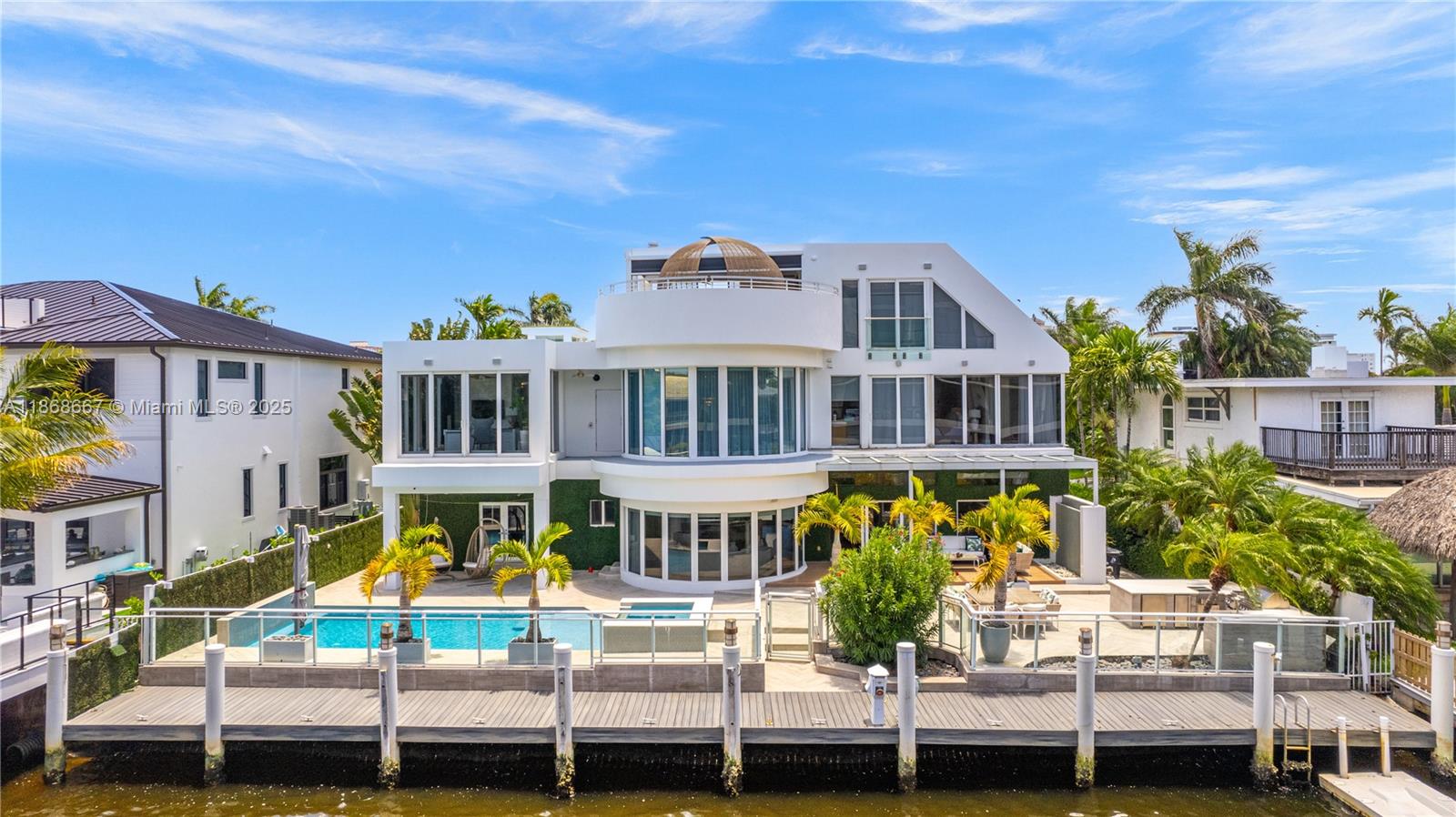 Step into the epitome of contemporary luxury with this stunning 7BR/8.5BA waterfront masterpiece in Fort Lauderdale. Boasting 90’ of frontage, this three-level estate captures breathtaking views from the primary suite, rooftop patio, and lush backyard. Walls of glass, open floor plan, impact windows, top-of-the-line appliances, and advanced security define modern elegance. Entertain with a rooftop terrace, summer kitchen, and private dock. Fully furnished and available for immediate occupancy.