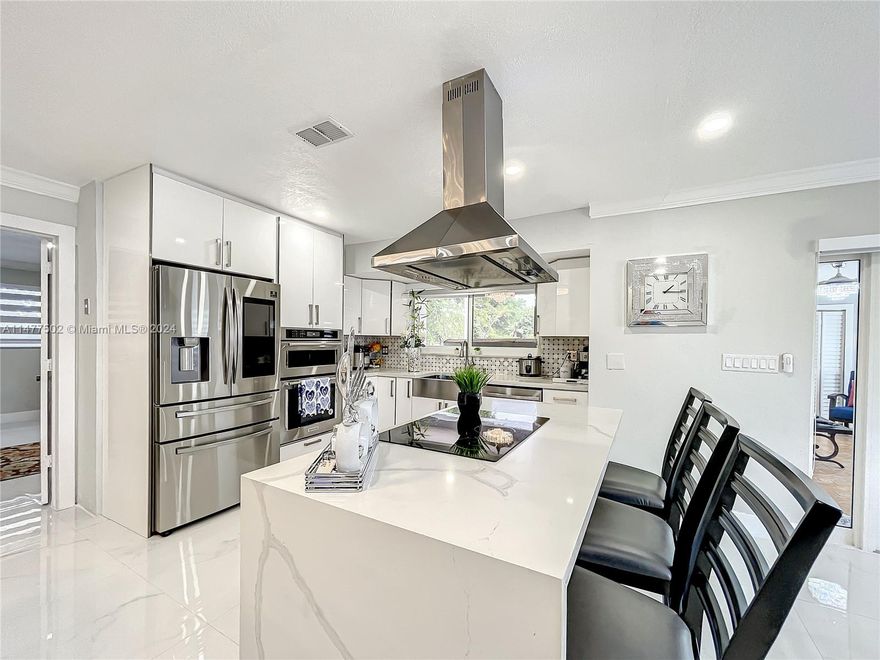 This 4/2.5 Mid Century Modern home delightedly welcomes you with open arms. Whether it be it's fully renovated features and finishes, greenery, proximity to schools, open kitchen with stainless steel appliances, in-law quarters which has been renovated as well, and last but definitely not least.....       Close to ONE FULL ACRE of lot footage!!!   Great for entertainment. Don't wait and schedule a showing immediately soon.