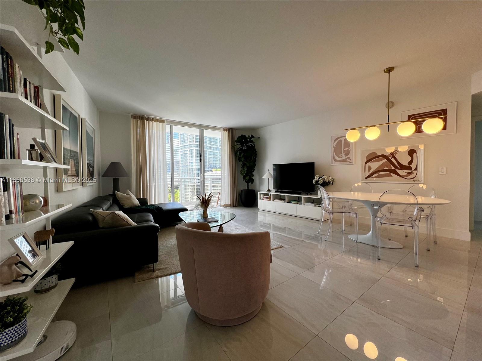Experience refined living in the prestigious Carbonell building, one of Brickell Key's most desired addresses. Spacious 2-bedroom, 2.5 bath residence spanning 1,418 sq. ft, featuring ceramic and marble floors throughout, a renovated kitchen, and spectacular water views, The apartment is in pristine condition and includes custom Italian-made curtains. Carbonell offers exceptional amenities including complementary valet for visitors, two tennis courts, and two story state-of-the-art gym, bay front pool, BBQ area, jacuzzi, sauna, and racquetball/basketball courts. Unit comes with one parking space. Unfurnished unit. AVAILABLE 10/01/2025