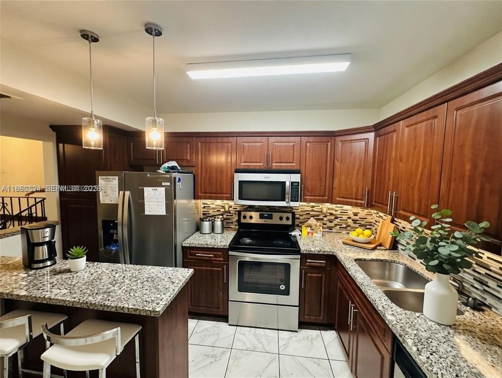 Photo of 4850 SW 63rd Ter #323, Davie, FL 33314 (MLS # A11860324)