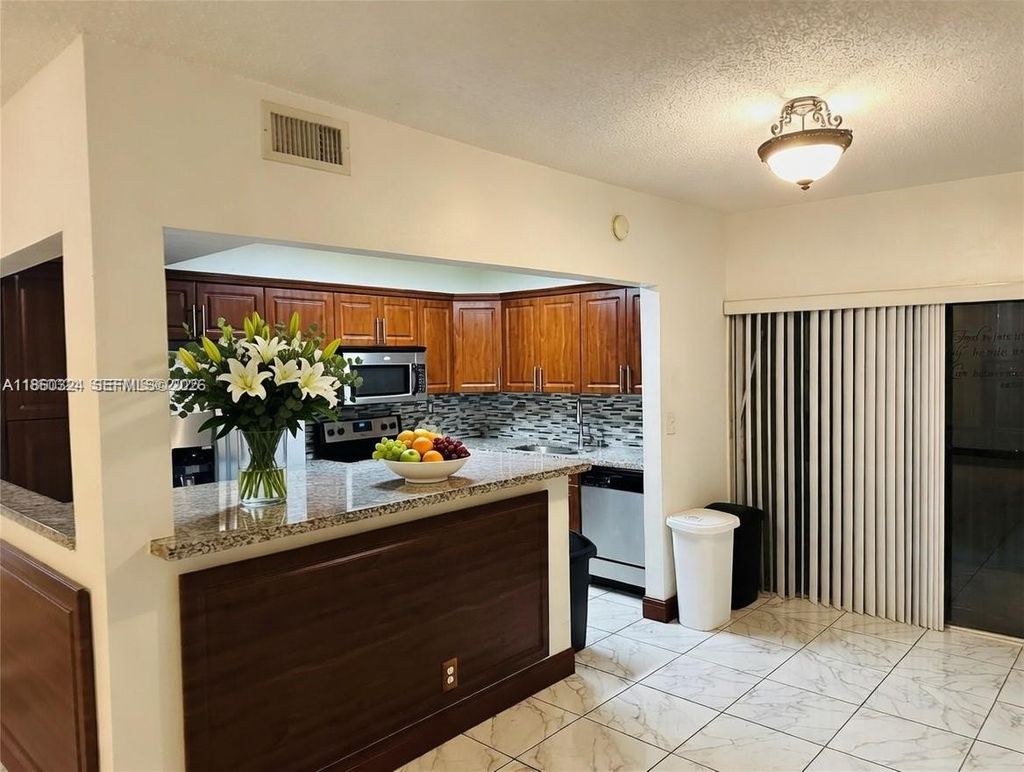 Photo of 4850 SW 63rd Ter #323, Davie, FL 33314 (MLS # A11860324)