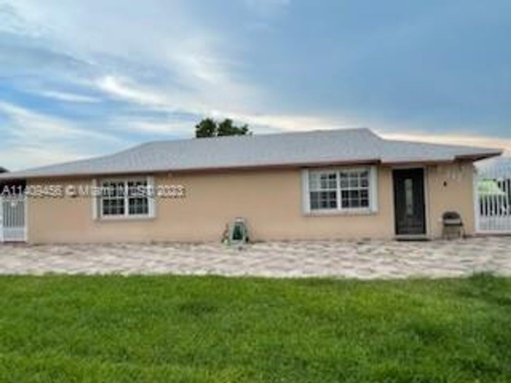 Photo of 217 Azucana Rd, South Bay, FL 33493 (MLS # A11409456)