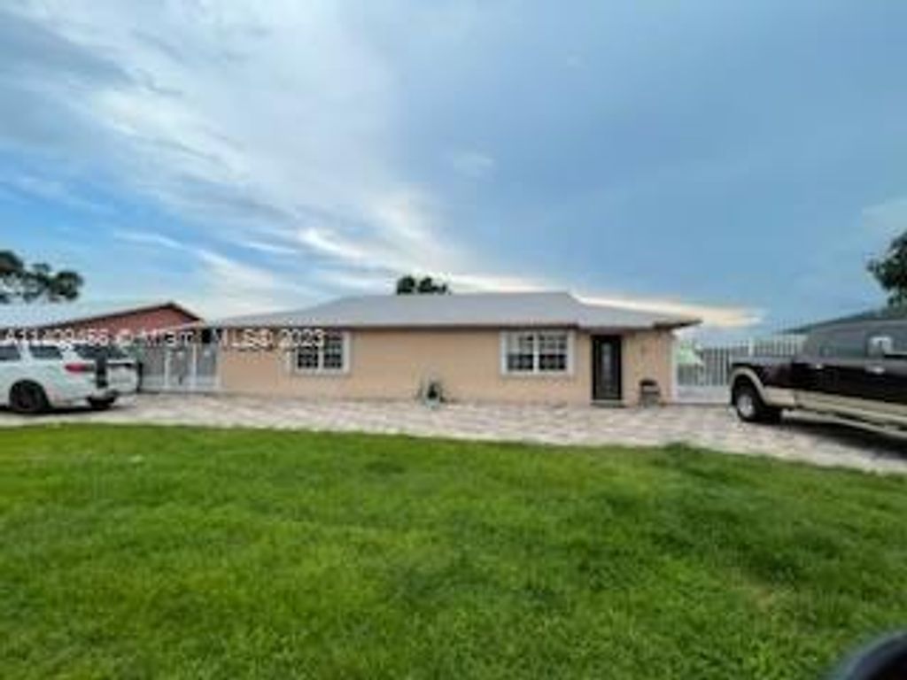 Photo of 217 Azucana Rd, South Bay, FL 33493 (MLS # A11409456)