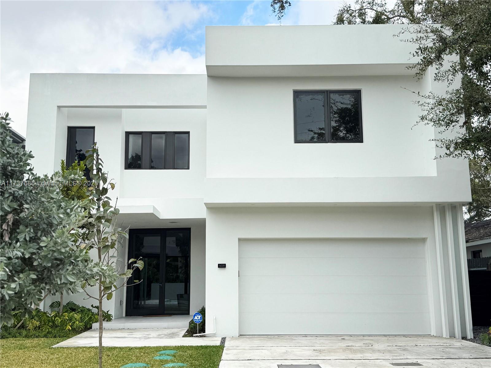 Introducing a stunning new construction marvel in the idyllic neighborhood of Ponce Davis. This 2-story, 5-bedroom, 5.5-bath home embodies tropical modernism with luxury finishes. The ground floor features a state-of-the-art kitchen with high-end finishes seamlessly connected to the family room, bedroom suite and a 2-car garage. The second floor boasts a lavish master suite with dual walk-in closets, large balcony, a spacious den, and convenient laundry room. Outside, an expansive backyard oasis awaits, complete with a stunning pool, summer kitchen, and lush tropical landscaping. Full impact glass w/ whole-house generator + underground gas tank makes this home storm ready. Minutes from Downtown Coral Gables and The Shops at Sunset Place.