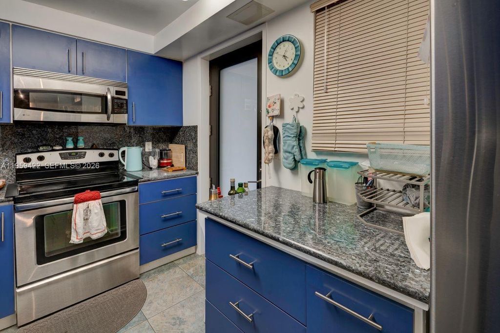 Photo of 301 Golden Isles Dr #502, Hallandale Beach, FL 33009 (MLS # A11959422)