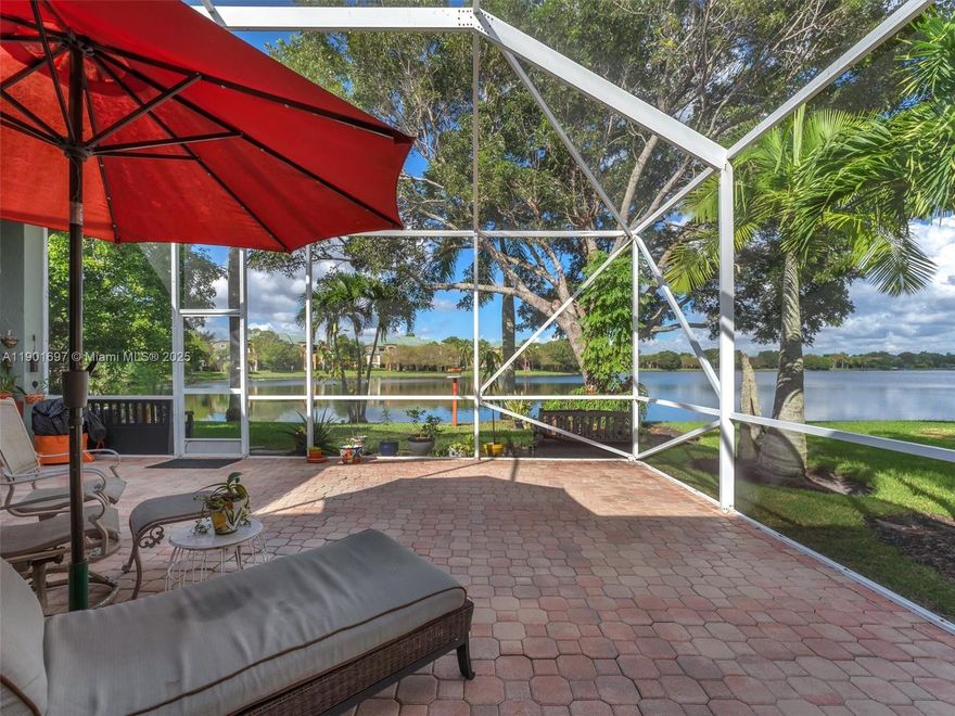 Welcome home to this spacious 4-bed/3-bath single-family residence, nestled on a serene cul-de-sac in the gated community of Mariners Cove. With over 2,500 sq ft of living space, this home offers breathtaking lake views and a lush backyard filled with avocado, mango, lychee and other fruit trees from your 16,500 private tropical oasis. The open layout captures natural light overlooking the water, perfect for entertaining or simply relaxing. Located minutes from major highways and all shopping, dining and recreation that Coral Springs offers, you’ll enjoy both privacy and convenience. Don’t miss this rare opportunity for upscale lake-front living in a safe, gated setting.