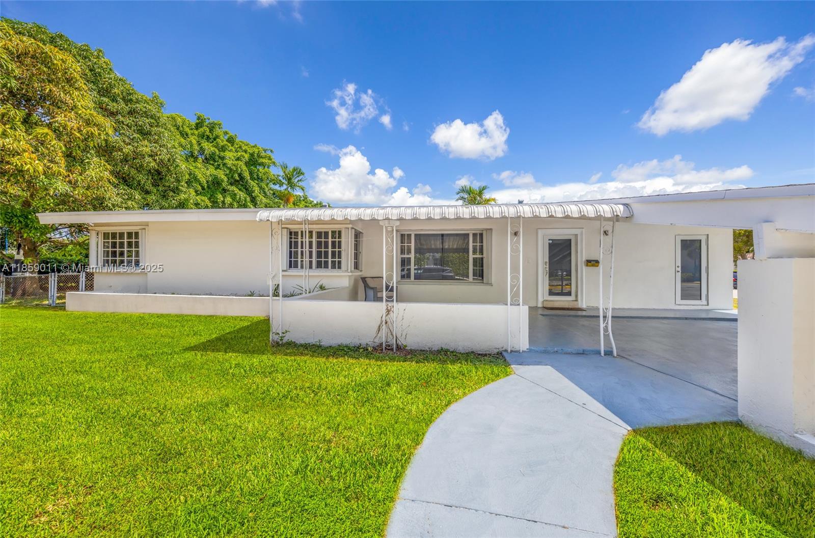 Welcome to this beautifully maintained 4 bed, 2 bath home offering comfort and style throughout. Marble floors add a touch of elegance, and the spacious kitchen with quartz countertops is perfect for cooking and gathering. The split floor plan gives the primary suite its own private space, while the guest bedrooms are tucked away on the opposite side, ideal for peace and quiet. Enjoy the convenience of a separate laundry room with a full size washer/dryer, fresh interior paint, and a large driveway with plenty of parking. The backyard features a gorgeous mango tree that offers fruit and natural shade, perfect for relaxing outdoors. Easy to show! Available for immediate move-in.