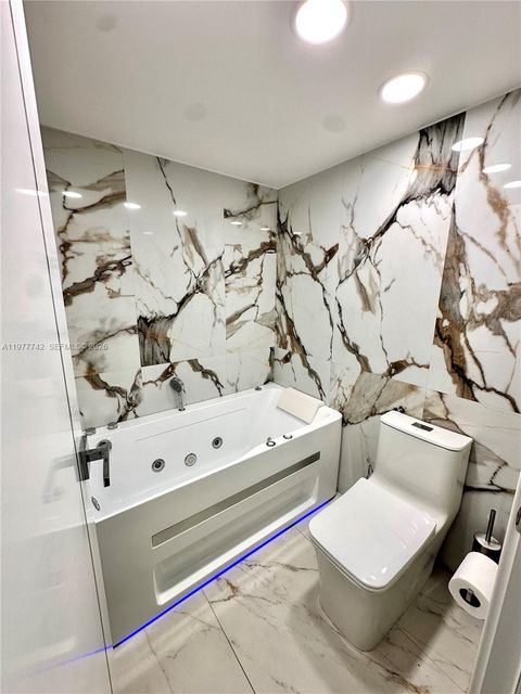 Tiny photo for 671 NE 195th St #205E, Miami, FL 33179 (MLS # A11977742)