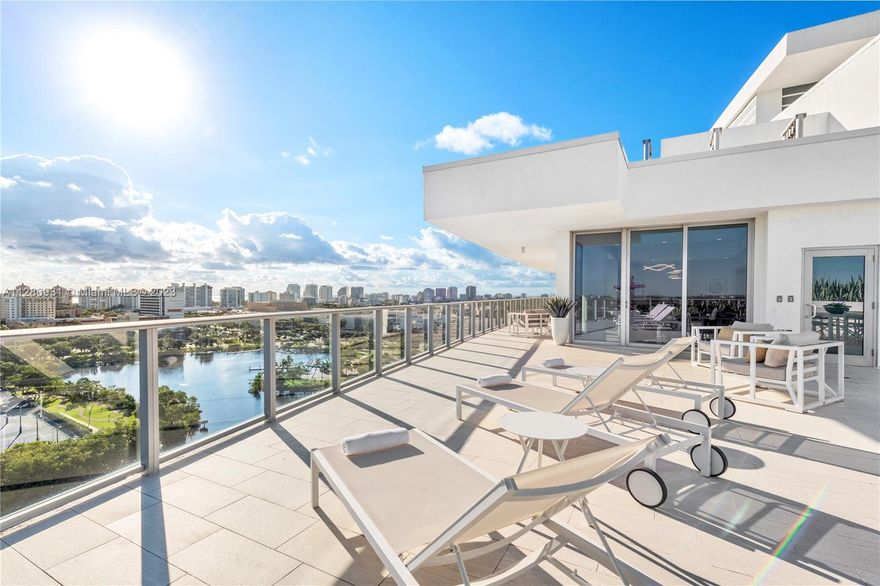 Spectacular 2 Story Penthouse with Sweeping Views of the Ocean, Intracoastal & Skyline | Open Concept Gleaming with Natural Light Designed for Indoor/Outdoor Living with 2,500 SF Terrace | Chef’s Kitchen Includes Large Sub-Zeros, Wolf Gas Cooktop, Dual Ovens, Wet Bar & 3 Wine Coolers | Spacious Primary Suite with 2 Walk-In Custom Closets & Modern Glass Enclosed Shower + Jacuzzi | Private 2 Car Garage & Boat Slip Included | Electric Shades & Lutron Lighting Throughout | Direct Entry into Private Foyer | 10' Ceilings | 40,000 SF of Resort Quality Amenities: Heated Lap Pool, 7,000 SF Gym, Fitness Studio, SPA with Sauna, Steam & Treatment Rooms, Sunset Deck with Hot Tub, Residents Lounge & Cucina to Entertain, 3 Guest Suites, Front Desk Attendant, Valet, 2 Dog Walks & Central Location