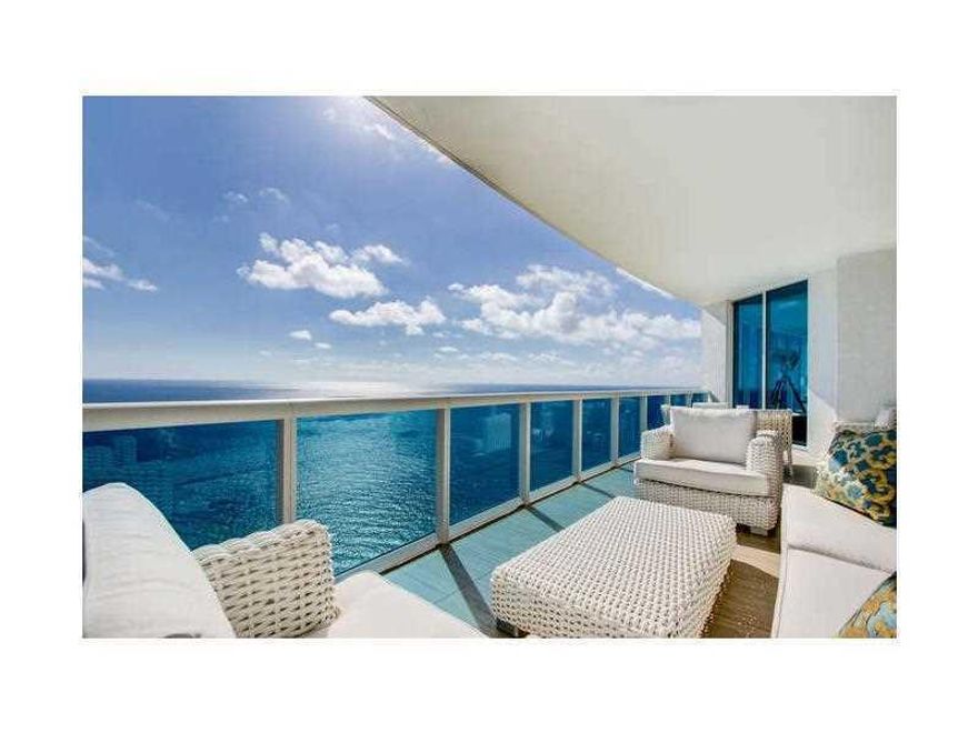 TRUMP HOLLYWOOD SKY RESIDENCE. Corner unit, flow through apartment, 5086sq ft under A/C, 927sq private terraces, 5bd, 5.5 bths, plus library TV room living & dining area & gourmet kitchen. High ceilings, floor to ceiling impact windows, 3 terraces to view sunrise & sunset w/ EAST WEST & NORTH exposure.  A private elevator to the unit,  white marble & honey onyx accents in private entry, Venetian plaster walls in unit, custom master closet & bath featuring Thassos marble, Kohler DVT shower system & jacuzzi tub, electric shades, smart house, w/surround sound & entry camera. Full building amenities featuring fantastic pool and beach service everyday. EXTRAS:5 parking spaces, 2 storage bins plus private cigar box on Mezzanine level cigar room. Spectacular PARADISE FOR ONLY 857/sq ft under a/c