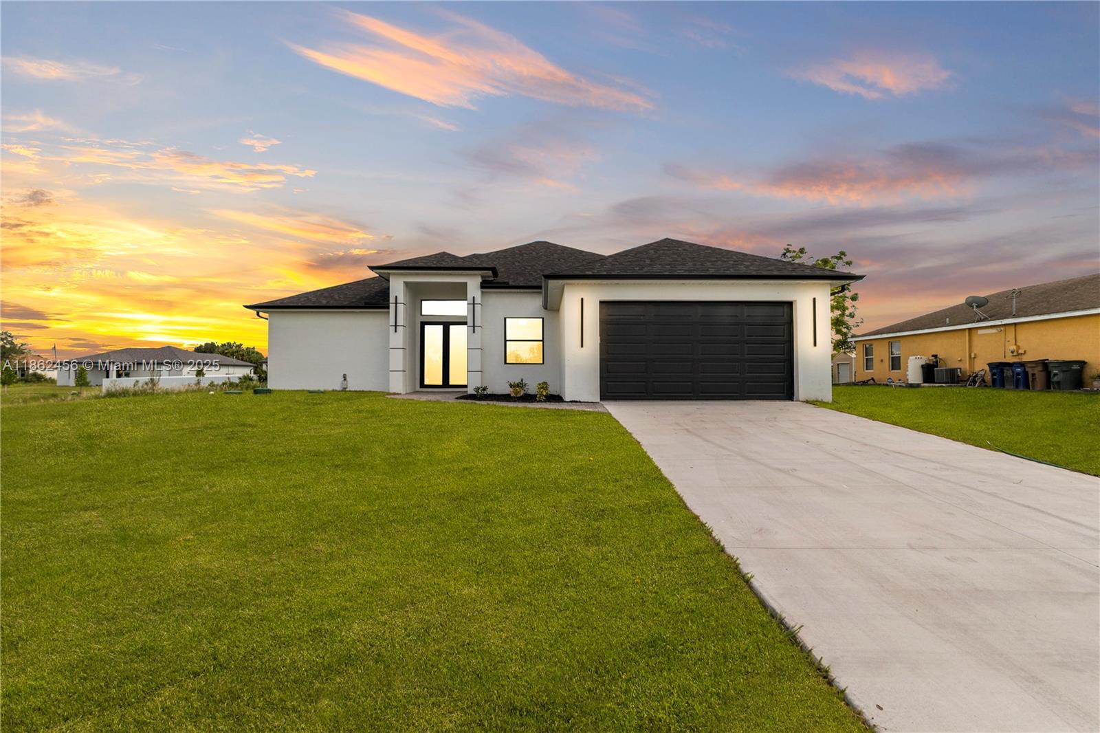 This brand-new construction features 3 bedrooms plus a den and 3 full bathrooms, offering 1,868 sq. ft. of living space with a total of 2,637 sq. ft.. The open-concept design highlights a modern kitchen with a quartz waterfall island, custom cabinetry, stainless steel appliances, and elegant pendant lighting. Large-format porcelain tile floors, soaring ceilings, and impact-resistant windows and doors provide comfort, safety, and style. Enjoy an expansive lanai with a fully equipped outdoor kitchen, perfect for entertaining or relaxing. Don’t miss this opportunity—schedule your showing today!