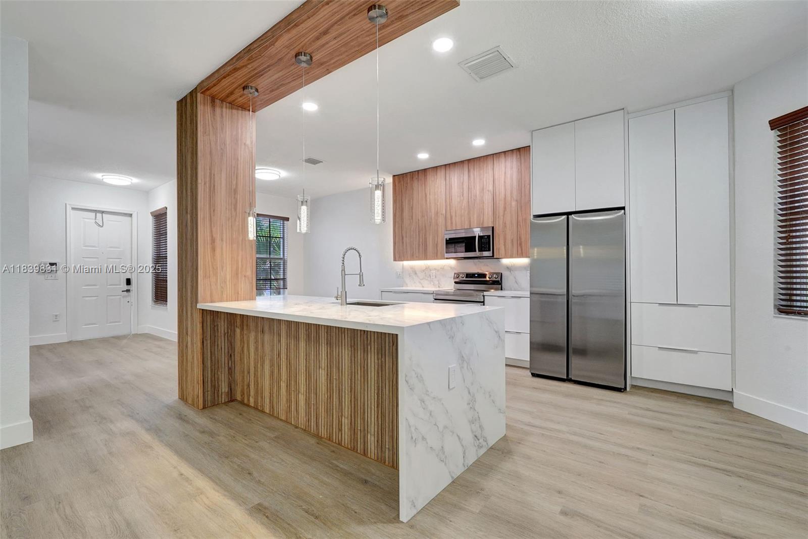 Completely Remodeled 4 bed / 2.5 bath Single-family home in the desirable Gated community of SilverIles! CORNER lot offers extra privacy. Open & bright areas welcome you as soon as you walk in! NEW ROOF 2025, Interior & Exterior JUST PAINTED & NEW VINYL FLOOR installed. NEW KITCHEN is beautifully designed & very inviting, stainless steel appliances & veined quartz countertops. All bedrooms on 2nd floor. ALL BATHROOMS WERE UPGRADED & tastefully designed with nice tile combinations & custom vanities. Accordion shutters on all windows. Backyard is perfect to relax with a covered & paved area. 2 Car garage with A/C. Well maintained Community features a lovely clubhouse with a pool, gym & playground. Great location close to restaurants, shopping centers, schools & main highways. Easy to show