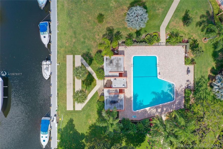 Welcome to this beautifully renovated from top to bottom 5th (top) floor canal view condo! This unit features 2 bedrooms & 2 bathrooms, split floor plan, an updated open concept living space. Enjoy your favorite beverage from one of the two balconies with a canal view. The whole unit has been remodeled from the wiring to the plumbing with modern fixtures and updated wood plank tile flooring and includes a laundry room, which is rarely available in this complex! No area has gone untouched! This complex is equipped with great amenities such as 24/7 Security gate, tennis courts, pool, and also dock space available for boats at a great rate! HOA fee includes CABLE and WIFI!  Community allows for 2 small pets under 20lbs. Seller will pay special assessment in full at closing.