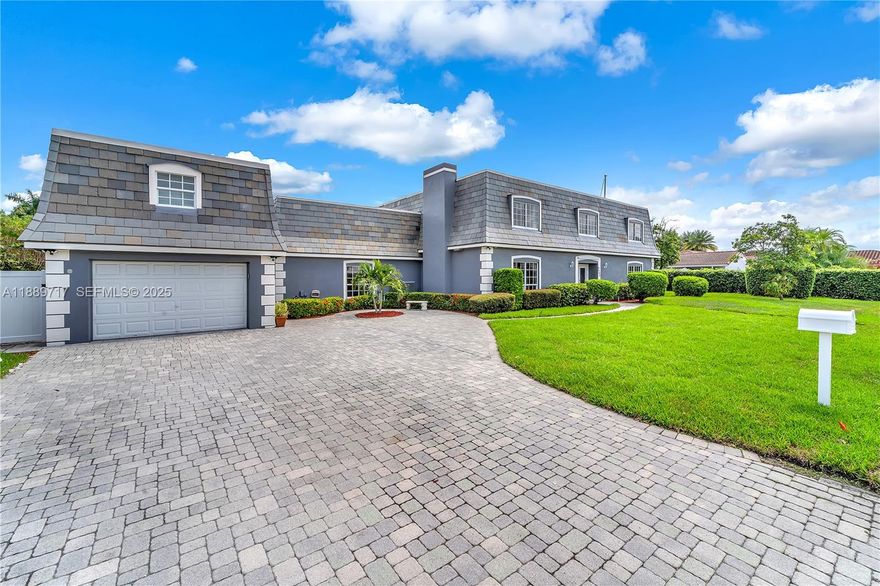 Impressive waterfront estate offering scale, privacy, and versatility in the heart of Lighthouse Point. Situated on approximately 100 feet of waterfront along the North Grand Canal with direct ocean access and no fixed bridges. The property features a 97-ft dock with boat lift, while still preserving expansive outdoor entertaining space alongside the pool and terrace.

With 6,594 sq ft, the residence includes 7 bedrooms and 6.5 baths, including a private guest suite above the garage, ideal for extended family, guests, or staff. Interior spaces are generous and flexible, allowing the home to live comfortably for everyday use or large gatherings.

The primary suite offers a renovated bath, impact glass is installed throughout, and the eastern-exposure backyard captures morning sun and tranquil canal views. A rare opportunity to own a substantial waterfront home in a highly sought-after Lighthouse Point neighborhood.