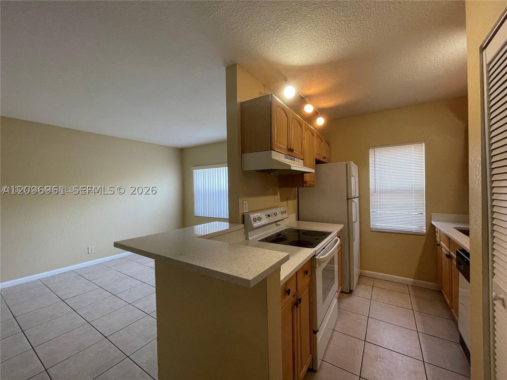 Photo of 11626 NW 26th Ct #4, Coral Springs, FL 33065 (MLS # A12096961)