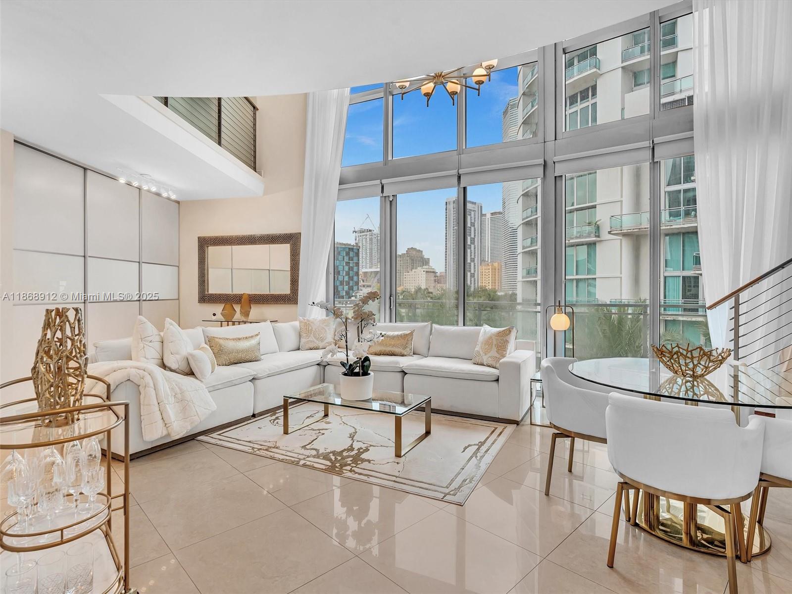 Ivy at Riverfront located at walking distance of Brickell Ave Miami Florida your own private oasis. The spectacular apartment double height ceilings 2 Bed & 2 Bath + Den Just walking distance to Brickell City Centre. Two Parking spaces a few steps from the unit, 5 star Amenities, pool, gym, spa, business center, gated community, children play area, concierge service. Living and Dinning Room marble floors, and the 1st floor bedroom, Master Bedroom 2nd Floor large walk in closet with custom made California closets, washer and dryer stain steel appliances unit is impeccable a must see call listing agent for showing instructions.