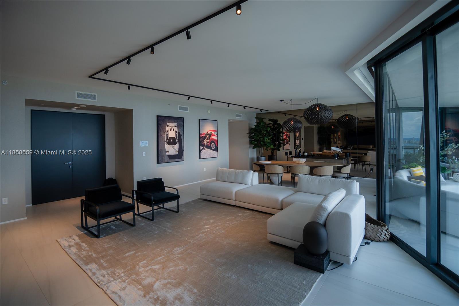 Unit 3502 at One Thousand Museum by Zaha Hadid offers a rare half-floor layout wrapped in floor-to-ceiling glass with unobstructed views of Biscayne Bay, the Atlantic Ocean, and the Miami skyline. This fully furnished Artefacto-designed home features Poliform cabinetry, quartz countertops, Sub-Zero & Gaggenau appliances, a custom wine display, motorized shades, and distinctive built-in furniture throughout. The primary suite includes an added walk-in closet and private terrace with sunset views. Enjoy world-class amenities including the Sky Lounge, Aquatic Center, Wellness Center, rooftop helipad, and 24/7 concierge, valet, and security — all just minutes from Miami’s waterfront, fine dining, and luxury shopping. Artefacto furniture included.