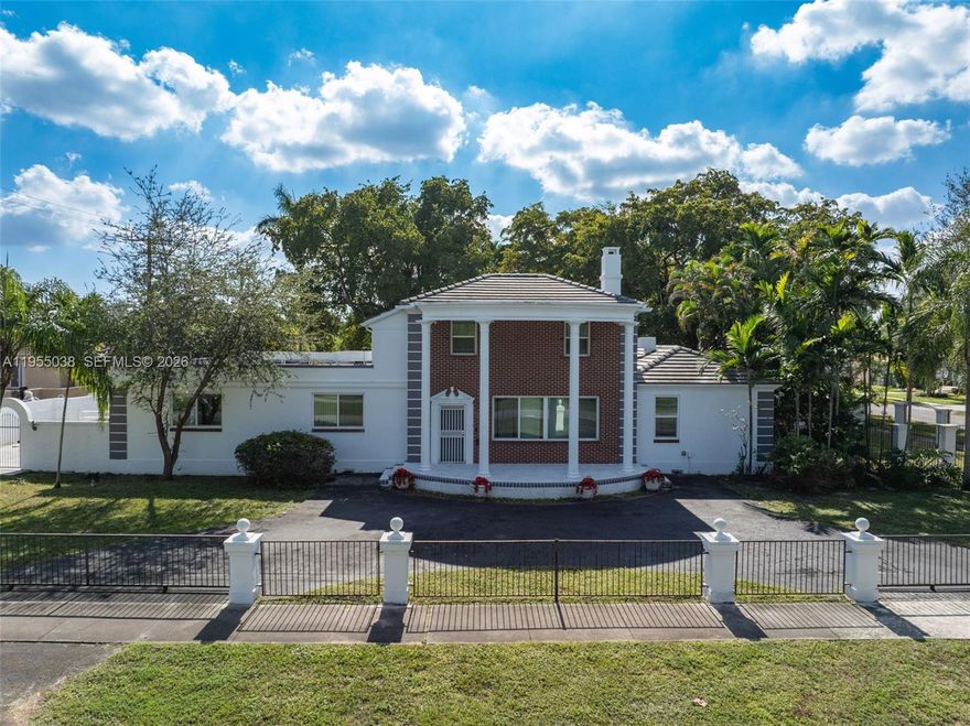 Exquisite contrast of old and new defines this 5-bedroom, 4.5-bath residence. Original hardwood floors set the tone throughout, complemented by a formal front room with a wood-burning fireplace, an elegant dining room, and a family room/library with Mahogany French doors opening to a grand sunroom filled with natural light. Two downstairs primary bedrooms share a spacious, newly remodeled Jack-and-Jill bathroom featuring dual shower heads, including a relaxing rain shower and a therapeutic option. A third downstairs bedroom functions perfectly as a nanny or housekeeper suite with access to a full bath. Upstairs, two en-suite bedrooms retain original hardwood floors and timeless character.

The remodeled eat-in kitchen overlooks the pool and offers new cabinetry, appliances, LVP flooring, automatic base cabinet lighting, and abundant storage including a pantry, island seating storage, and concealed garbage and recycling bins. An oversized two-car garage connects directly to the kitchen and includes extensive overhead storage.

Set on over half an acre, the fully enclosed private backyard is ideal for entertaining, featuring a swimming pool, bar area, half bath, fenced dog kennels, a 36-foot patio deck with 16-foot gazebo, and a covered deck suited for games or outdoor dining. The home is wired for CCTV, offering enhanced security, with ample space remaining for play, gatherings, and catered events.
