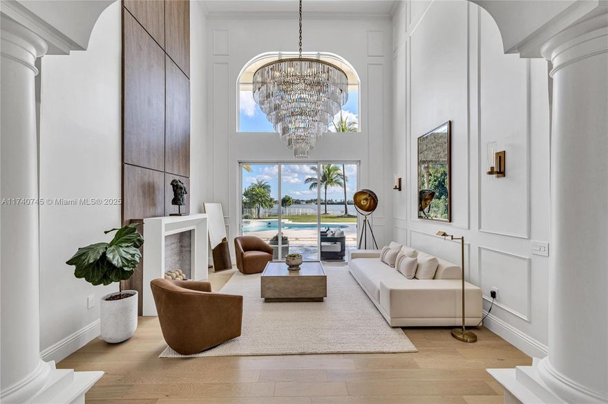 Sitting on half an acre in a prestigious gated community, this 4,264 sq. ft. masterpiece redefines luxury living. This 6-bedroom, 4.5-bathroom mansion has been fully remodeled with Restoration Hardware-inspired finishes, contemporary architecture, and modern elegance. Inside, enjoy an open-concept layout, custom lighting, and high-end details throughout. The home features a new 6-year-old roof and impact windows for added durability and peace of mind. The backyard is an entertainer’s dream, featuring a 500 sq. ft. pool, full outdoor kitchen, and private basketball court, all overlooking 65 feet of breathtaking lake views. With spacious bedrooms and designer touches at every turn, this home offers the perfect blend of comfort, style, and sophistication— schedule your private tour today!