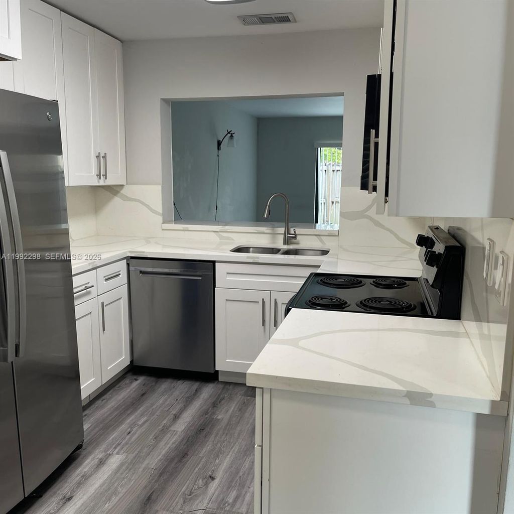 Photo of 301 E Palm Cir E #301, Pembroke Pines, FL 33025 (MLS # A11992298)