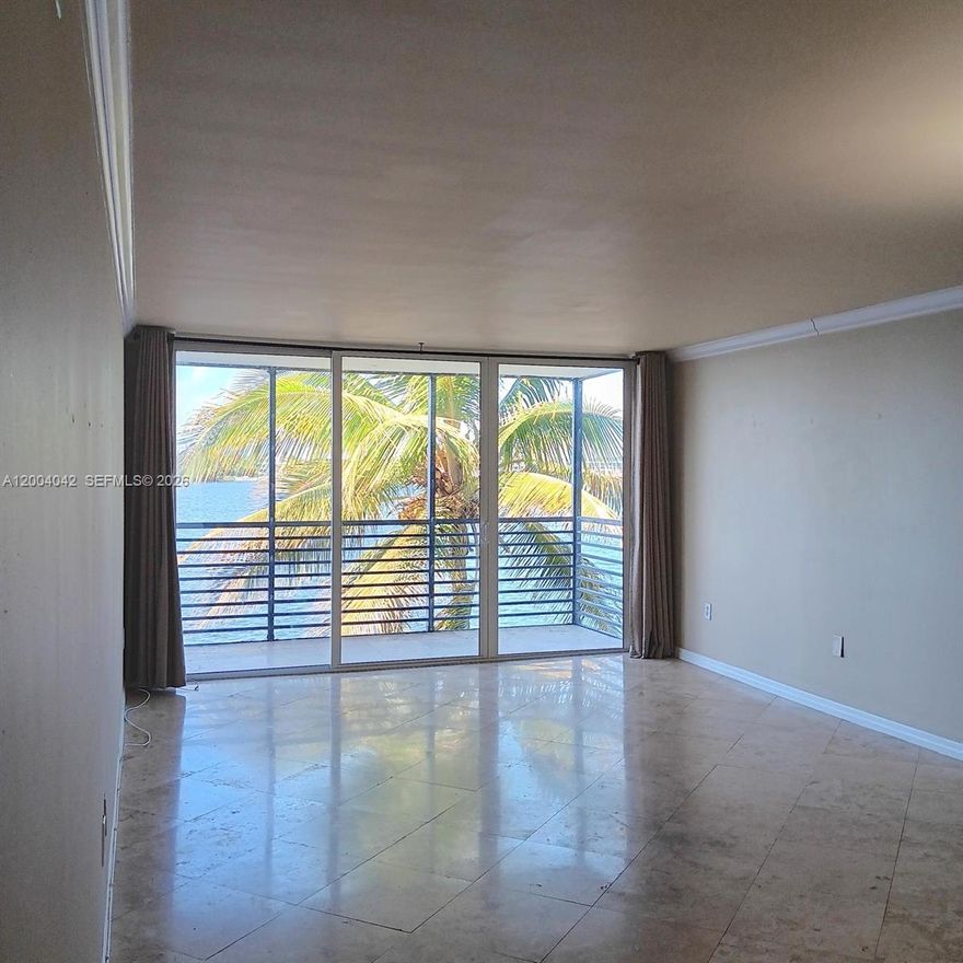 Million Dollar Unobstructed Panoramic Water Views in a Pet Friendly Residence up to 30 Pounds.
This beautifully designed and impeccably renovated condo offers a truly special living experience. Enjoy a spectacular intercoastal view framed by a stunning palm tree filled with coconuts, creating a serene and picturesque setting. The unit is filled with natural light and features an open-concept kitchen, remodeled bathrooms, and generous living spaces that feel both comfortable and elegant.

The unit includes additional storage and is conveniently located near the elevators and laundry facilities. Amenities include a heated pool, gym, sauna, billiards room, and BBQ area. The community offers gated entry, security guard, and camera surveillance for peace of mind.

Enjoy a scenic jogging path along the lake and canal, as well as a playground. Ideally located east of I-95, with easy access to expressways, top-rated schools, houses of worship, beaches, and Aventura Mall.

Impact windows and an impact-resistant front door provide added protection, while the spacious balcony is perfect for relaxing afternoons and enjoying breathtaking sunsets.

Centrally located in North Miami Beach with easy access to major roads. The building has completed its 50-year certification. A fantastic opportunity for first-time buyers or seasonal residents. Sold As-Is.
