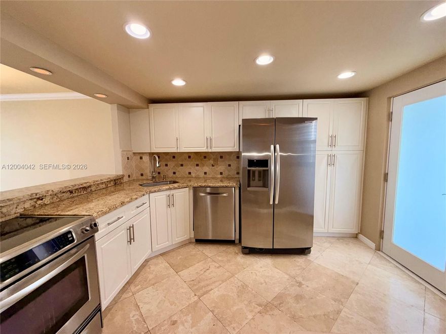 This beautifully designed and impeccably renovated condo offers a truly special living experience. Enjoy a spectacular intercoastal view framed by a stunning palm tree filled with coconuts, creating a serene and picturesque setting. The unit is filled with natural light and features an open-concept kitchen, remodeled bathrooms, and generous living spaces that feel both comfortable and elegant.

The unit includes additional storage and is conveniently located near the elevators and laundry facilities. Amenities include a heated pool, gym, sauna, billiards room, and BBQ area. The community offers gated entry, security guard, and camera surveillance for peace of mind.

Enjoy a scenic jogging path along the lake and canal, as well as a playground. Ideally located east of I-95, with easy access to expressways, top-rated schools, houses of worship, beaches, and Aventura Mall.

Impact windows and an impact-resistant front door provide added protection, while the spacious balcony is perfect for relaxing afternoons and enjoying breathtaking sunsets.

Centrally located in North Miami with easy access to major roads. The building has completed its 50-year certification. A fantastic opportunity for first-time buyers or seasonal residents. Sold As-Is.