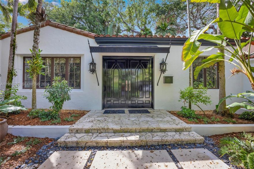 Located in the prestigious heart of South Coconut Grove, this extraordinary 2,733 square foot, 4 bedroom, 3 bathroom home exudes 1930’s charm, but with updates fit for the modern buyer!  The double-door entrance leads to a stately foyer with coral rock floors opening to the spacious eat-in kitchen with center island, new stove, and stainless steel appliances.  To the opposite side of the foyer sits the fabulous living room with vaulted wood-beamed ceilings with skylights, stunning fireplace, and cozy office nook with built-ins.  The split floorplan includes 2 bedrooms as well as the stunning primary suite with sitting room, walk-in closet, elegant bathroom, and pool views to one side, while an additional bedroom/bathroom is privately located on the other side of the home.  The 8,064 square foot corner lot is landscaped with native plants, oolite stone borders, gracious outdoor living areas, and a stunning tropical pool.  Other special features include impact glass throughout, generator, beautiful vintage tile, stone, and wood flooring, and so much more in Miami’s most desired neighborhood.
