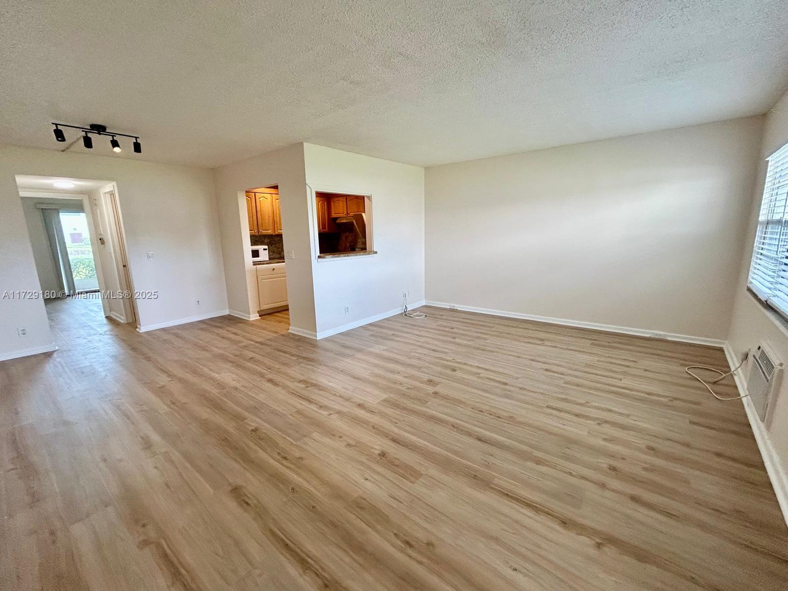 Nice 1 bed/1.5 bath with brand new floors and new SS appliances. Screen porch with lake view. Great lifestyle at this outstanding + 55 community with immaculate gardens and lakes, free bus services to local markets, includes a temple and resort alike amenities; tennis courts, pickle-ball courts, heated pools, and a huge clubroom with library, theater, billiard and card rooms, with organized activities all year around (shows, dances, movies, games, events).