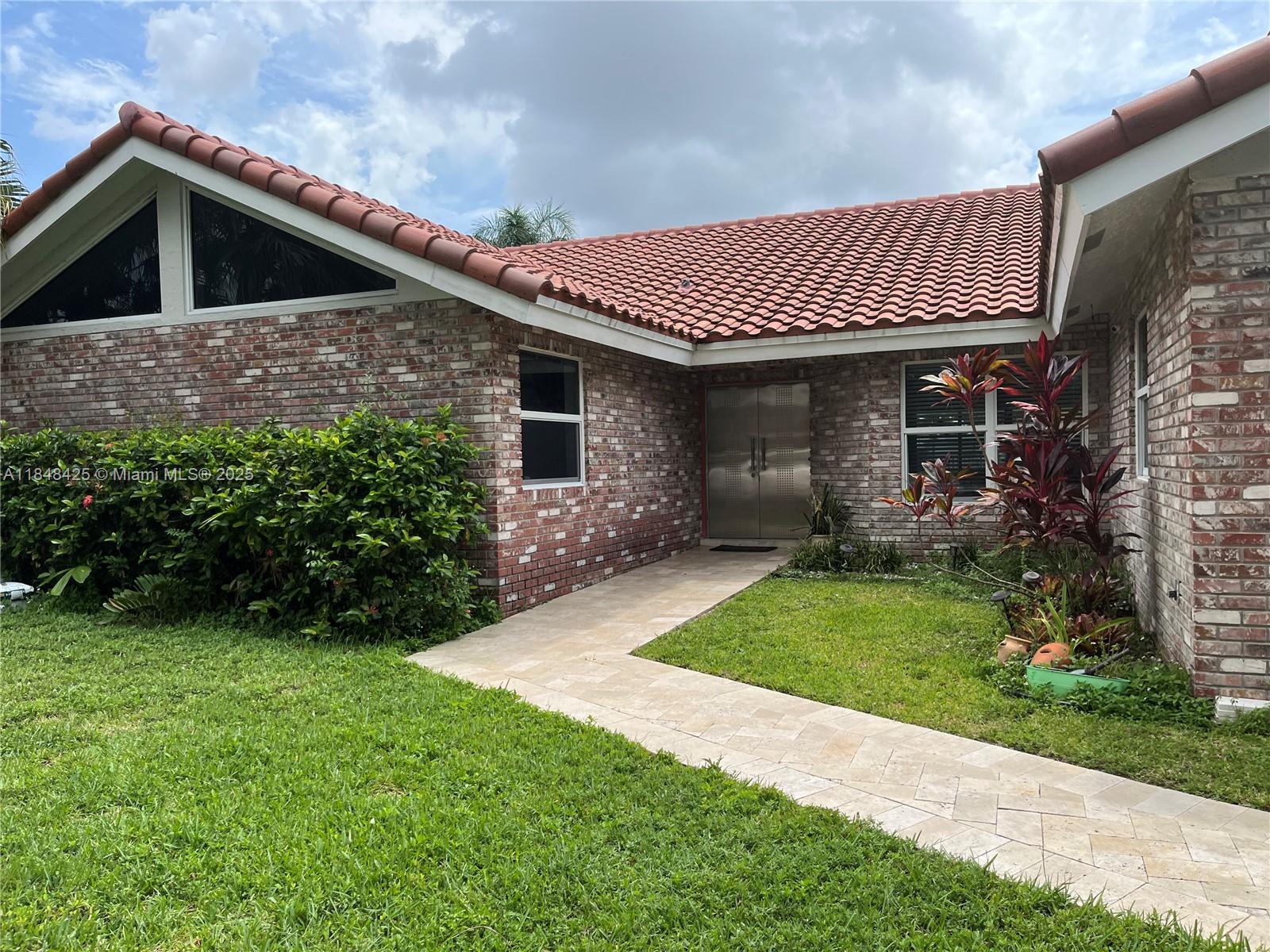 Welcome to this spacious 4-bedroom, 2-bathroom home located in the desirable city of Coral Spring. This charming property features a bright and airy open floor plan with ample natural light throughout. The kitchen boasts modern appliances and plenty of cabinet space. The master suite includes a HIS / Her walk-in closet and an en-suite bathroom. The additional bedrooms are generously sized, perfect for a growing family or guests. New ROOF, Solar Panel so no more pricey electricity bills, impact windows/doors and much more.