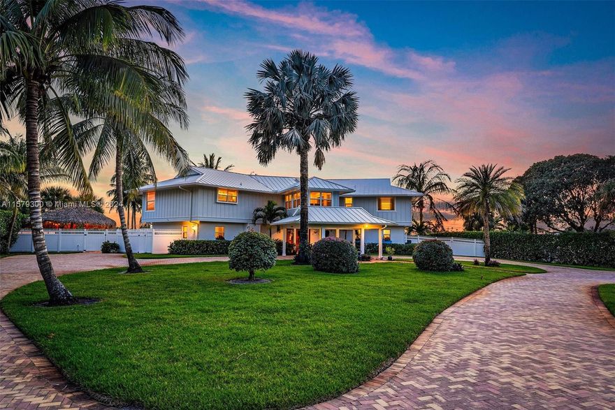 Boater and fisherman's dream, this waterfront  paradise located in Rocky Point on the protected Manatee Pocket only minutes from the inlet and downtown Stuart. This 1.08 acre beautifully landscaped property, circular driveway, with 2/1 guest house and detached two car garage.  Newer 6'x180' dock, with electric and water, will accommodate a large yacht plus two lifts, one 20,000 lb. lift and a 12,000 lb. lift. The remodeled main house 4 bedroom, 6 full baths home with water views from every room, features marble floors downstairs and wood floors upstairs.  Gourmet kitchen with gas cooking, eat in bar, and dining area, on demand hot water heaters.  Outside features pool with spa, surrounded by Old Chicago Brick, Tiki Hut with outdoor kitchen, new fenced yard and beach area by the water.