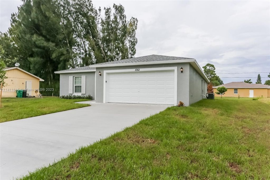 Photo of 1062 SW Fenway Rd, Port Saint Lucie, FL 34953 (MLS # A11411615)